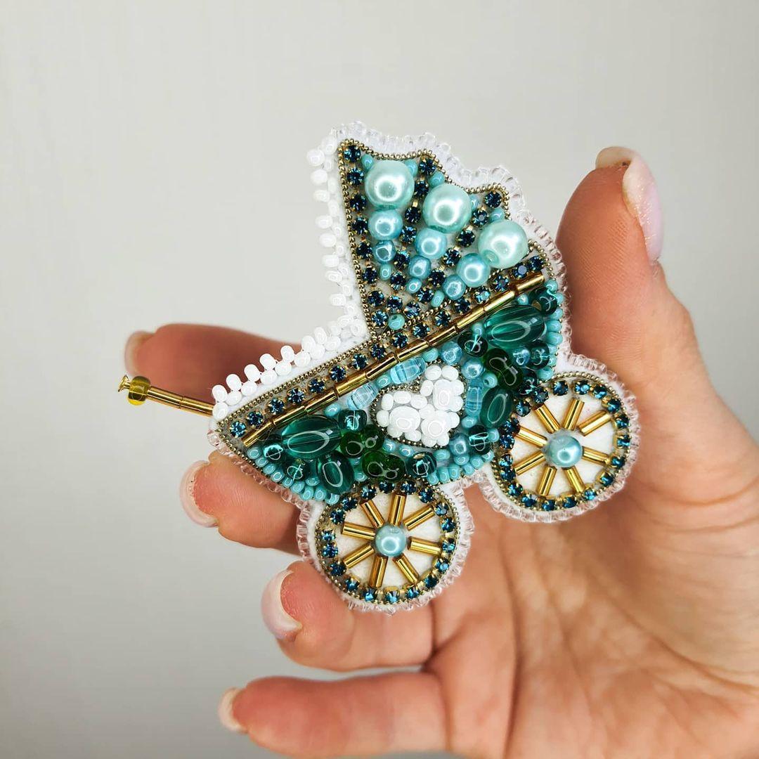 Crystal beadwork kit for a detailed stroller brooch.