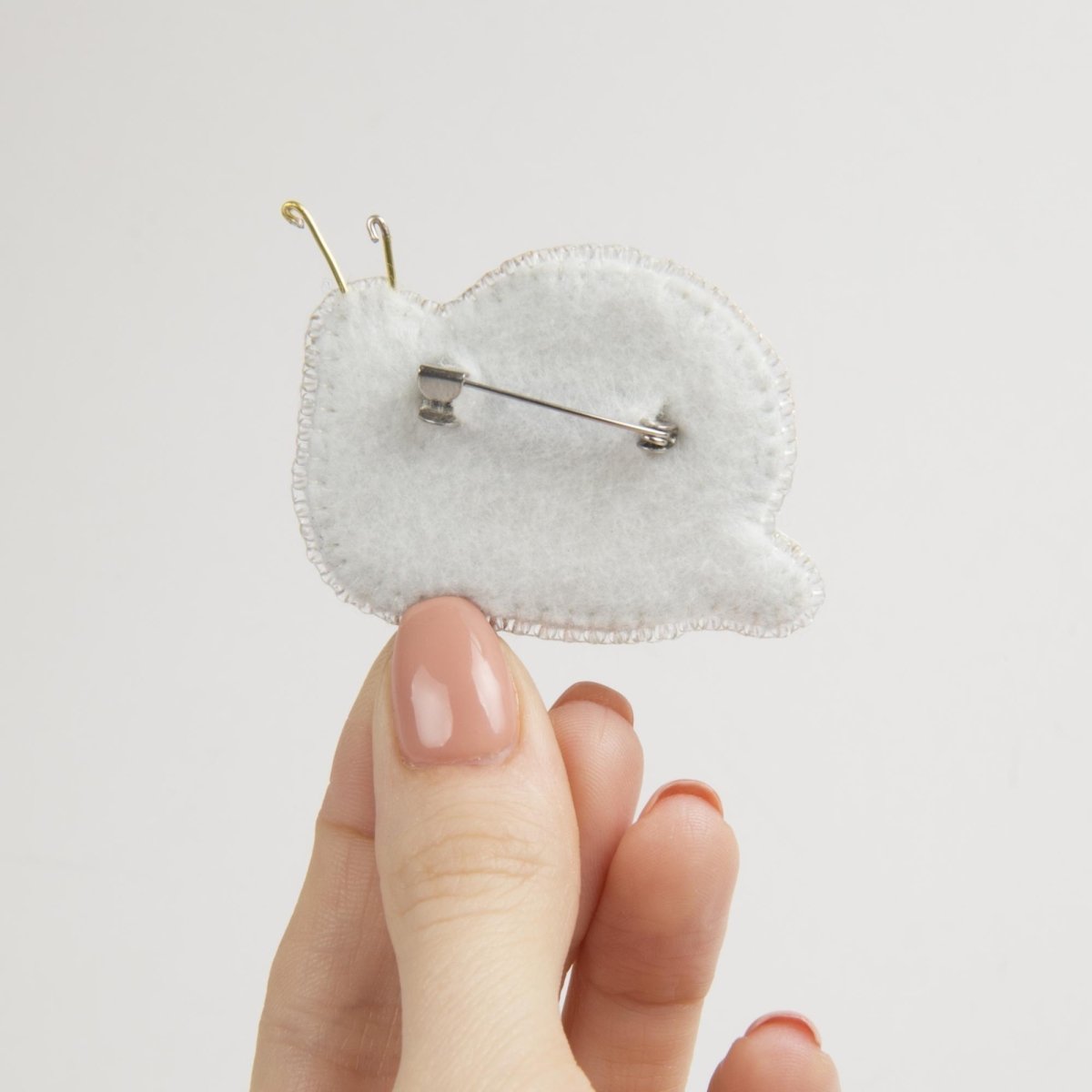 Beadwork kit for a glittering Crystal Art Snail brooch.