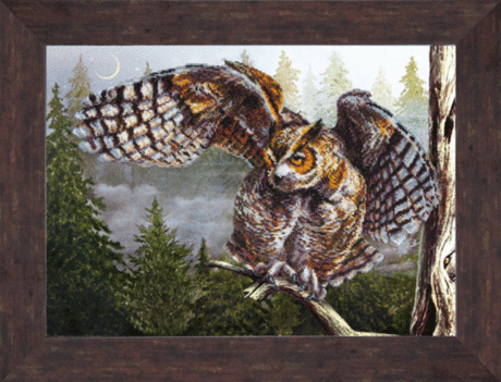 Completed bead embroidery of a wise bird perched on a branch from the Charivna Mit kit.