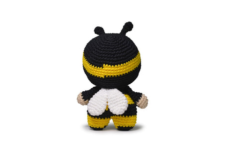 Completed Bee amigurumi on white background.