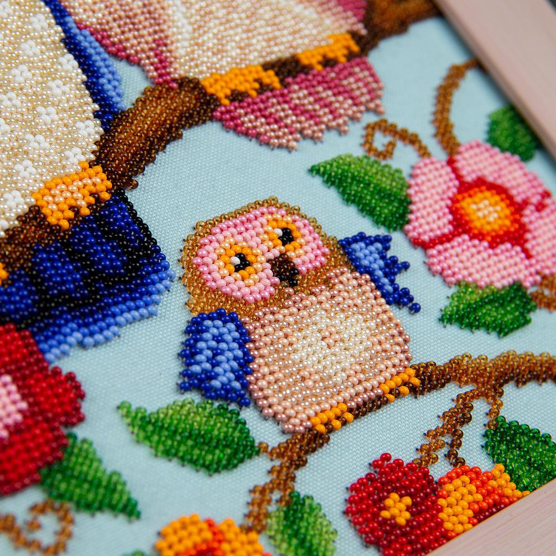 Partially finished Happy Family embroidery.